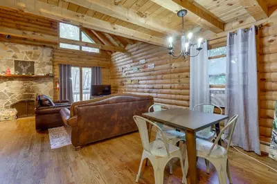 a living room with a couch and a table at Year-Round Outdoor Adventures Poconos Hideaway in East Stroudsburg