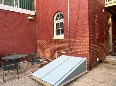 a mattress sitting next to a brick building at THE ADDAMS HOUSE - LANCASTER HISTORIC DISTRICT in Lancaster