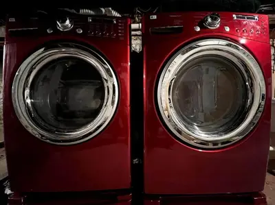 two red washing machines sitting next to each other at THE ADDAMS HOUSE - LANCASTER HISTORIC DISTRICT in Lancaster