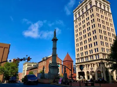 a monument in the middle of a city with buildings at THE WINTER HOUSE - HISTORIC DOWNTOWN LANCASTER in Lancaster