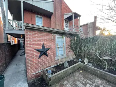 a brick building with a star on the side of it at THE HANNAH HOUSE - DOWNTOWN HISTORIC LANCASTER in Lancaster