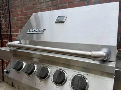 a grill with a cell phone on top of it at THE HANNAH HOUSE - DOWNTOWN HISTORIC LANCASTER in Lancaster