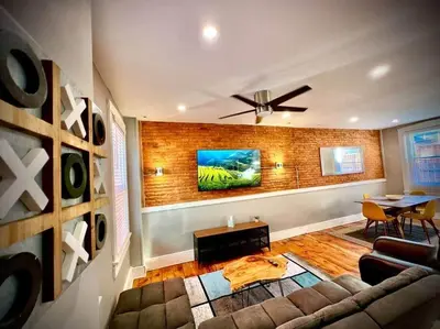 a living room with a couch and a table at THE STAGE HOUSE - CITY CENTER THEATER DISTRICT in Lancaster