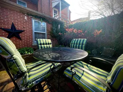 a patio with a table and chairs and a star at THE LIMÓNETTA - STUDIO IN HISTORIC LANCASTER in Lancaster
