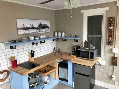a kitchen with a counter top with a microwave at BLETCHER GARDEN LOFT - LANCASTER HISTORIC DISTRICT in Lancaster