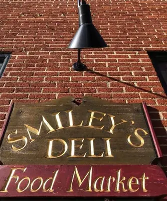 a sign for a food market on a brick building at THE STEVENS STUDIO - HISTORIC DOWNTOWN LANCASTER in Lancaster
