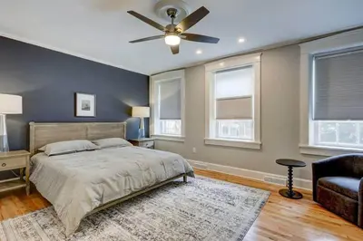 a bedroom with a bed and a ceiling fan at THE HAMILTON HOUSE - DOWNTOWN COLONIAL LANCASTER in Lancaster