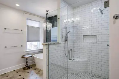 a white bathroom with a shower and a tub at THE HAMILTON HOUSE - DOWNTOWN COLONIAL LANCASTER in Lancaster