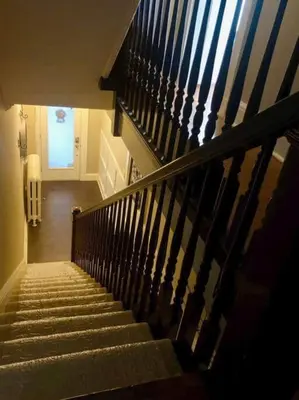 a staircase in a building with a stair case at THE ROYER HOUSE - LANCASTER'S HISTORIC DISTRICT in Lancaster