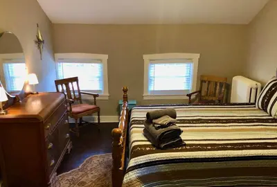 a bedroom with two beds and a desk and two chairs at THE ROYER HOUSE - LANCASTER'S HISTORIC DISTRICT in Lancaster