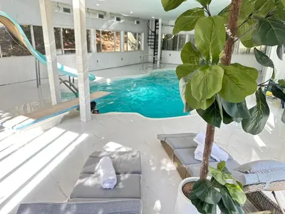 a swimming pool with blue water in a house at Honesdale in Honesdale