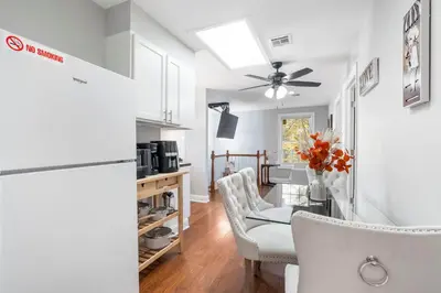 a kitchen and dining room with a table and chairs at Lacoco Suite in Roselle