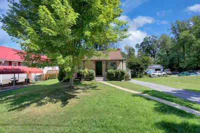 a house with a tree in the yard at Stay on State in Duncannon