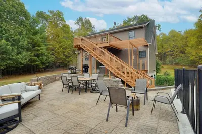 a house with a deck and a patio at Happy Trails House in Liverpool