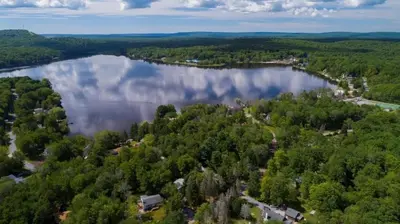 an aerial view of a lake in the woods at Lake Access, Hot Tub, Fire Pit in Arrowhead Lake