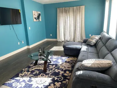 a living room with a couch and a table at Peace Sterling Haven in Newark