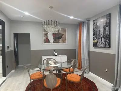 a dining room with a glass table and chairs at 7 Large Bedrooms Art-Inspired Art House in Newark