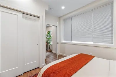 a bedroom with a bed and a window with blinds at Modern Princeton Stay Steps from Nassau Street in Princeton