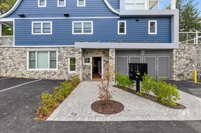 a blue house with a tree in front of it at Modern Princeton Stay Steps from Nassau Street in Princeton