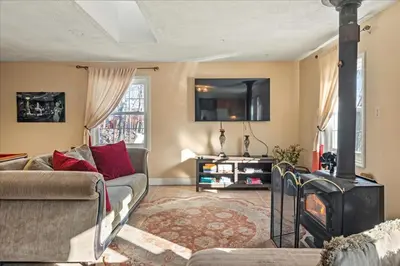 a living room with a couch and a fireplace at InDoor HotTub Pocono Mountains Home