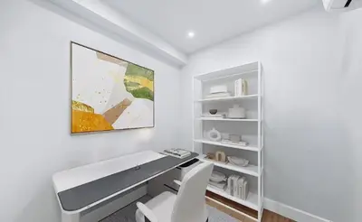 a white office with a desk and two chairs at Duplex Dream 4-Bedroom Bonbon in New York