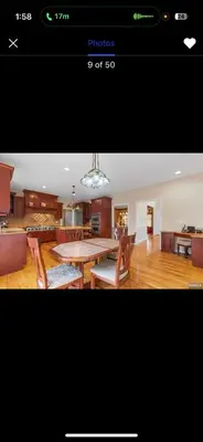 a picture of a kitchen with a table and chairs at villa in North Haledon