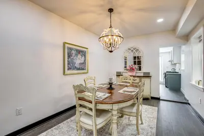 a dining room with a table and chairs and a chandelier at Updated Gem! Walk to Fishtown, 3 Mi to Center City in Philadelphia
