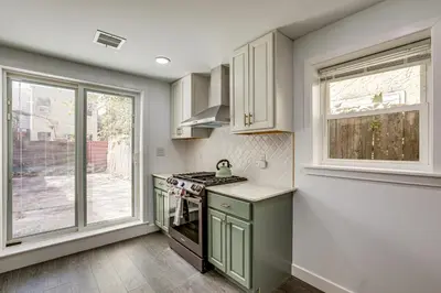 a kitchen with a stove and a window at Updated Gem! Walk to Fishtown, 3 Mi to Center City in Philadelphia