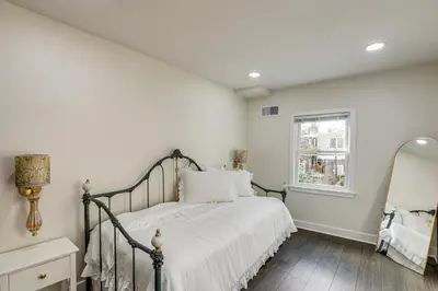 a bedroom with a bed and a mirror at Updated Gem! Walk to Fishtown, 3 Mi to Center City in Philadelphia
