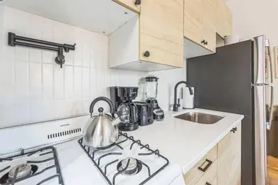 a kitchen with a stove with a tea kettle on it at New Studio in Center City that Sleeps 4 with Fast Wifi in Philadelphia