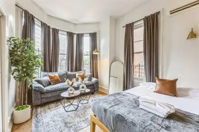 a bedroom with two beds and a couch at New Studio in Center City that Sleeps 4 with Fast Wifi in Philadelphia