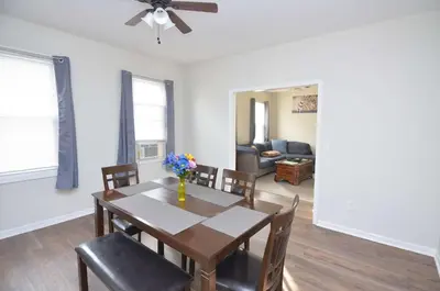 a dining room with a table and chairs at Cozy Beds with Parking, Laundry - Near RU, RWJ, NJ Transit in Highland Park