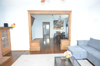 a living room with a couch and a table at Spacious Home with Parking, Laundry - Near RU, RWJ, NJ Transit in Highland Park
