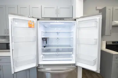 a white refrigerator with its doors open in a kitchen at Cozy Beds with Parking, Laundry - Near RU, RWJ, NJ Transit in Highland Park