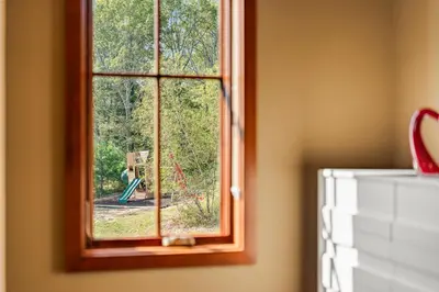 a window with a view of a playground at Pinnacle Pointe by Relaxtay 600 Acre Private Luxury Estate with Spa, Pool, Theater and Lake in Middletown