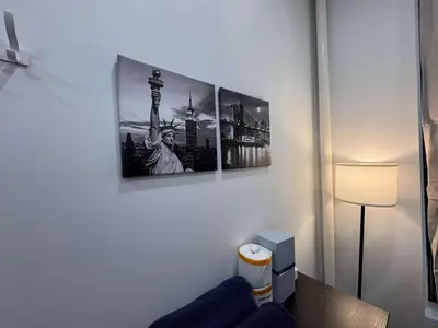 a room with three pictures on the wall at Room with Kitchen in Chelsea - Shared Bathroom - 3rd Floor Walk-UP in New York