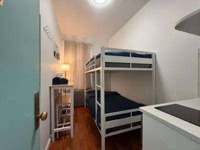 a small room with bunk beds in a kitchen at Room in Chelsea 2 with Kitchen - Shared Bathroom -5th Floor Walk-UP in New York