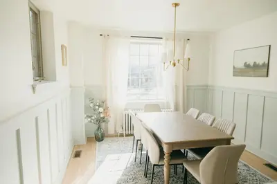 a dining room with a wooden table and chairs at Lady Grey Cottage - Hot Tub in Conestoga