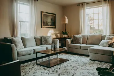 a living room with couches and a coffee table at Conestoga Cottage with Hot Tub in Conestoga