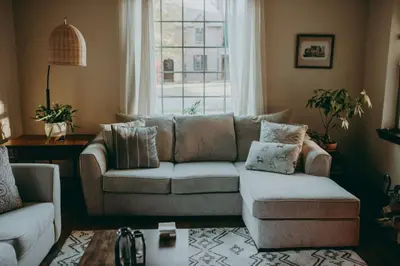 a living room with a couch and a window at Conestoga Cottage with Hot Tub in Conestoga