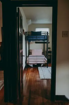 a hallway with two bunk beds in a room at Conestoga Cottage with Hot Tub in Conestoga