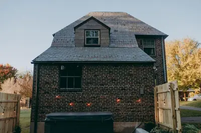 a brick building with a window and a roof at Conestoga Cottage with Hot Tub in Conestoga