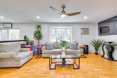 a living room with couches and a ceiling fan at 7 Mi to Slopes Family Getaway in Stroudsburg in Stroudsburg