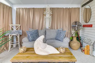 a living room with a couch and a coffee table at 7 Mi to Slopes Family Getaway in Stroudsburg in Stroudsburg