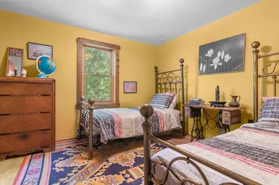 a bedroom with two beds and a desk at Bootleg Hollow in Andes