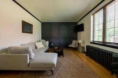 a living room with a couch and a chair at The Minimalist Retreat in Conestoga