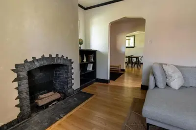 a living room with a fireplace and a couch at The Minimalist Retreat in Conestoga