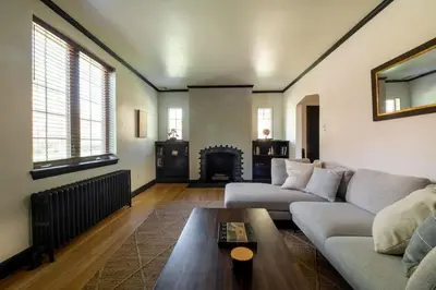 a living room with a couch and a fireplace at The Minimalist Retreat in Conestoga