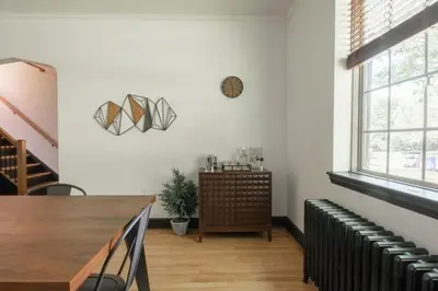 a dining room with a table and a window at The Minimalist Retreat in Conestoga