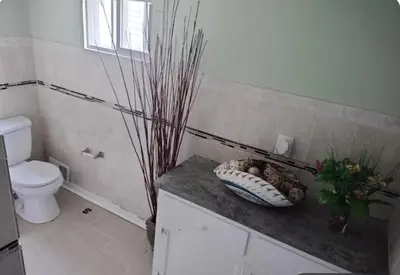 a bathroom with a toilet and a bowl on a counter at Private Room - Shared Bathroom in Perth Amboy